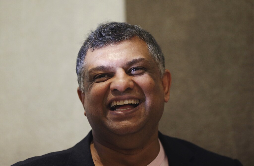 AirAsia's Chief Executive Officer Tony Fernandes speaks during a media conference near Changi Airport.
