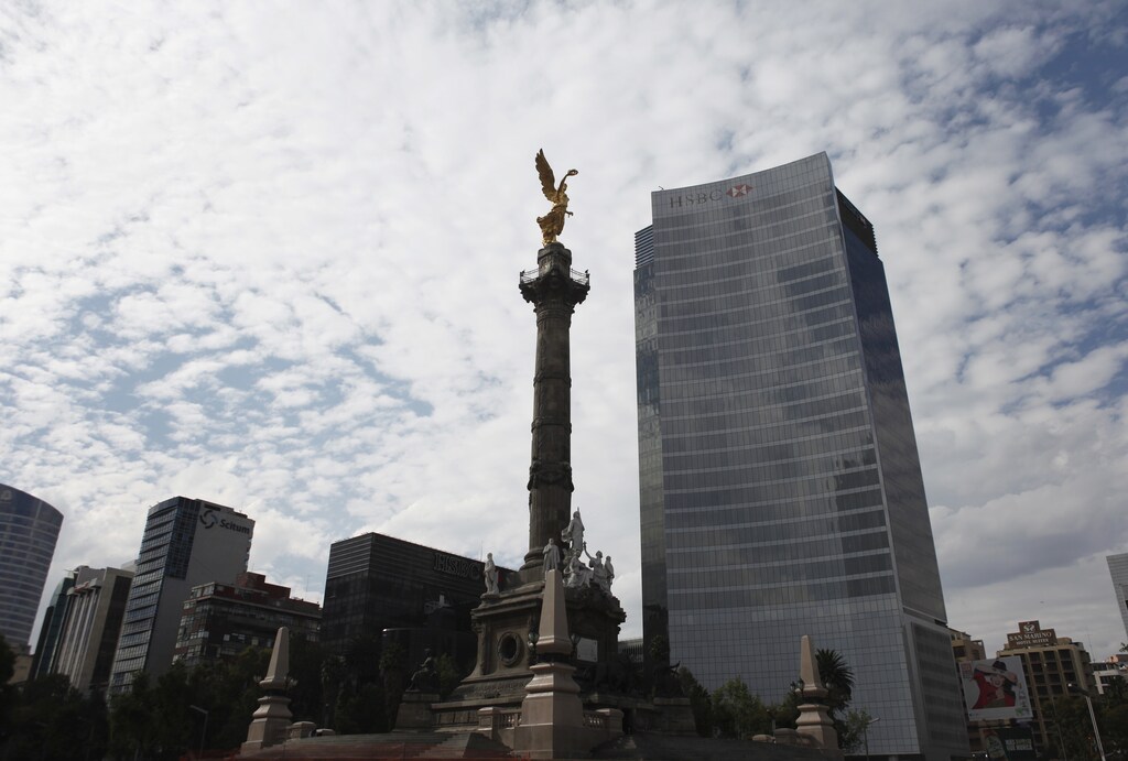 The Angel of Independence is seen near a building of HSBC in Mexico City, December 11, 2012.