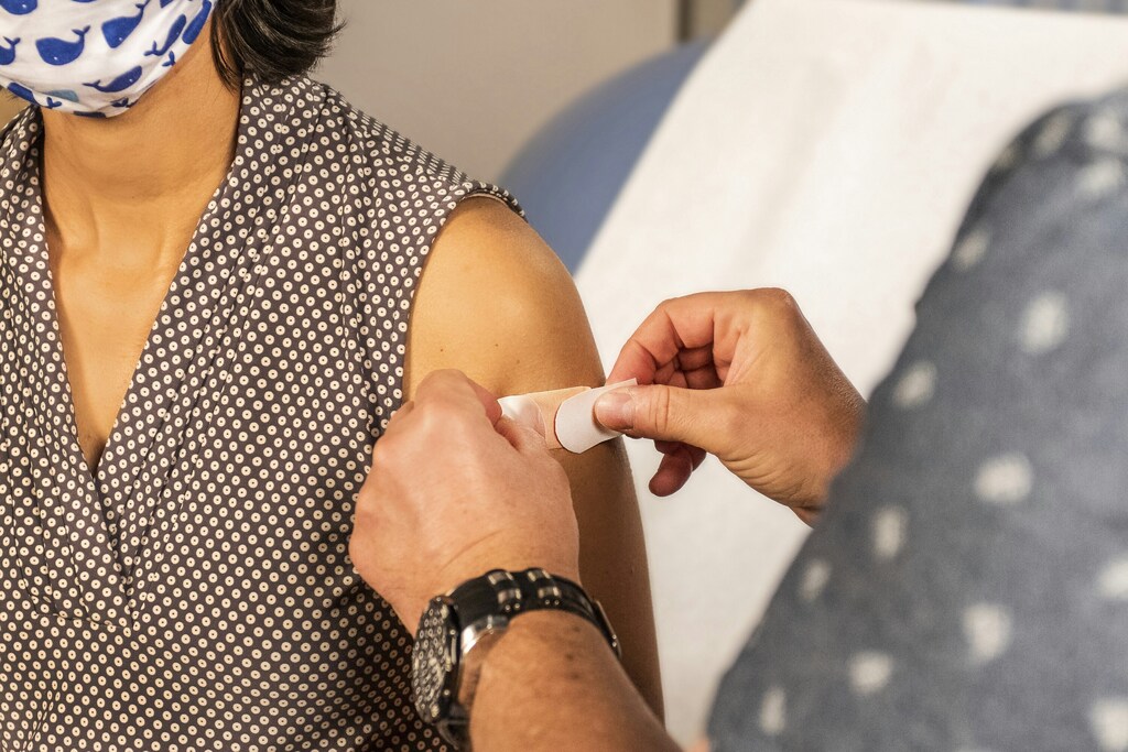 Measles on the rise: a patient receiving a plaster post-vaccination.