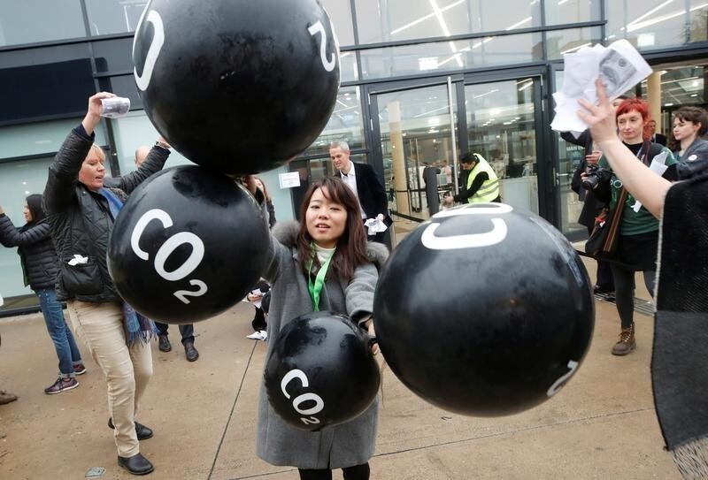 Activists protest against the carbon dioxide emissions trading in front of the World Congress Centre Bonn, the site of the COP23 U.N. Climate Change Conference, in Bonn, Germany, November 17, 2017.