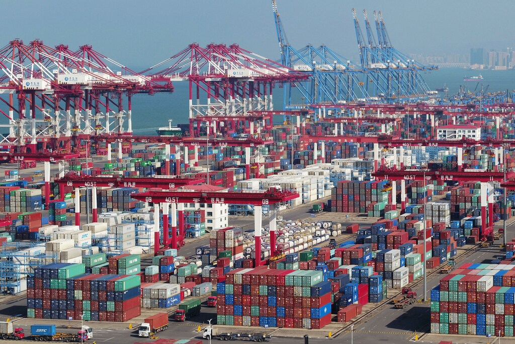 Containers and trucks are seen at a terminal of the Qingdao port in Shandong province, China November 8, 2018. REUTERS/Stringer ATTENTION EDITORS - THIS IMAGE WAS PROVIDED BY A THIRD PARTY. CHINA OUT. - RC1371AB0130