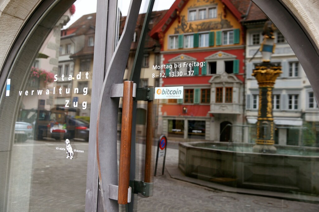 A sticker reading "Bitcoin accepted here" is displaye at the entrance of the Stadthaus town hall in Zug, Switzerland, August 30, 2016. Picture taken August 30, 2016. REUTERS/Arnd Wiegmann - RTX2OLUE