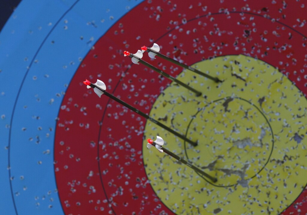 Arrows shot by Olympic hopeful and member of the U.S. archery team Ariel Gibilaro, 17, are seen in the target at La Bella's Farm in Branford, Connecticut April 17, 2012. Gibilaro, who practices four hours a day six days a week, will compete in the U.S. Olympic team trials for archery next week in Chula Vista, California. REUTERS/Jessica Rinaldi (UNITED STATES - Tags: SPORT OLYMPICS ARCHERY) - GM1E84I120401