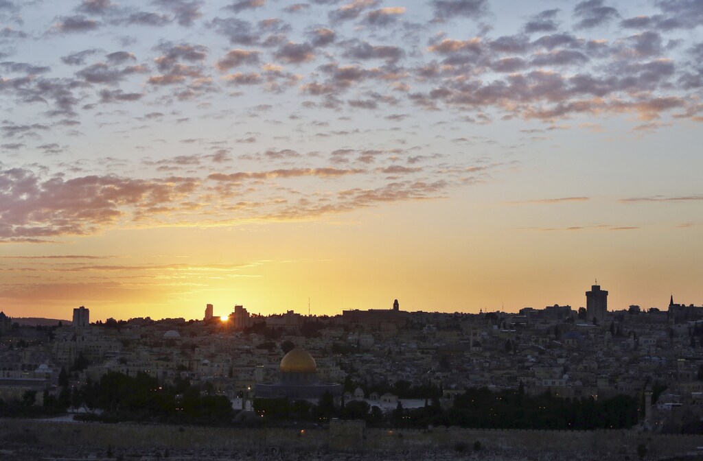 The Dome of the Rock (C) is seen as the sun sets over Jerusalem's Old City December 7, 2012. REUTERS/Ammar Awad (JERUSALEM - Tags: CITYSCAPE ENVIRONMENT) - RTR3BBL8