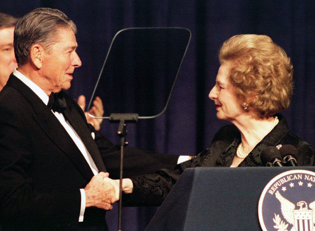 Former British Prime Minister Margaret Thatcher (R) shakes hands with former U.S. President Ronald Reagan as she participates in a birthday salute celebrating Reagan's 83rd birthday, February 3 in Washington. While at the $1,000 a plate fund-raising dinner, Reagan said the Democrats were trying to rewrite the history of his eight years in power and accused President Clinton of stealing Republican ideas for his recent State of the Union message.HB - RTR2EAL