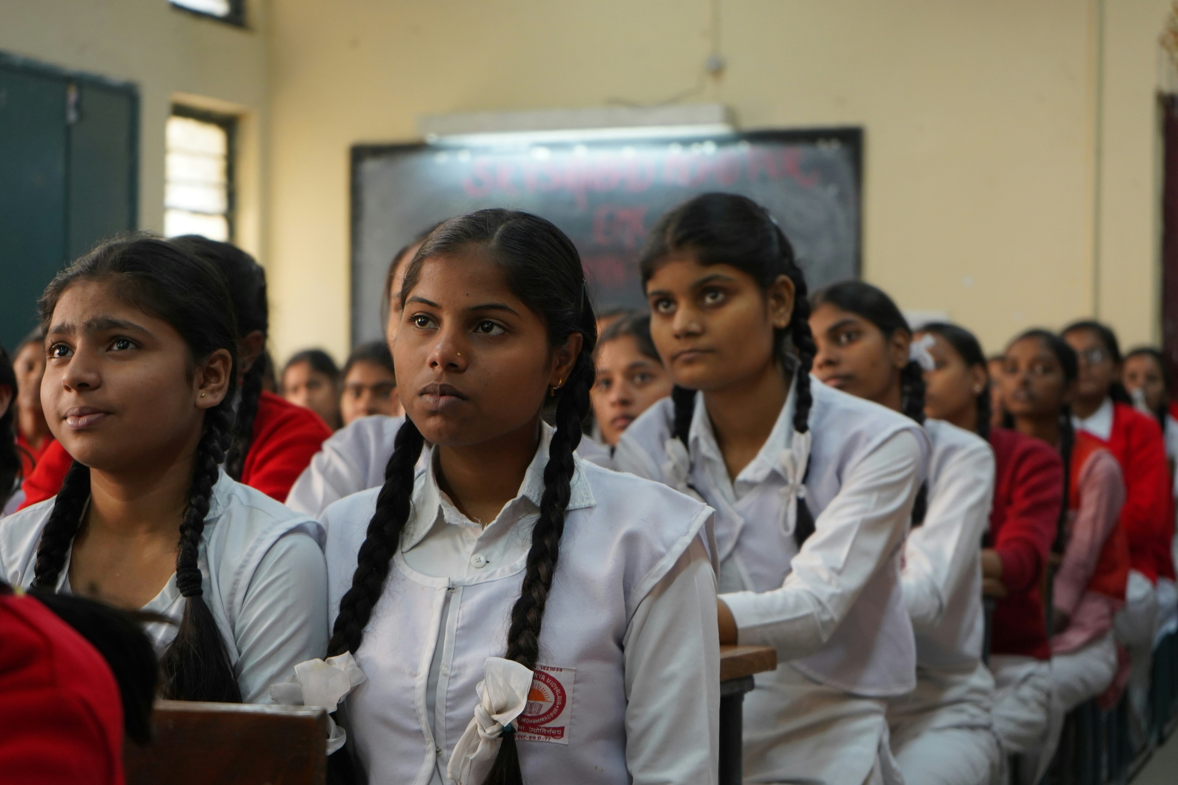 A classroom with attentive girls in middle school: Integrating AI in education effectively should be done with responsible and AI use in mind.