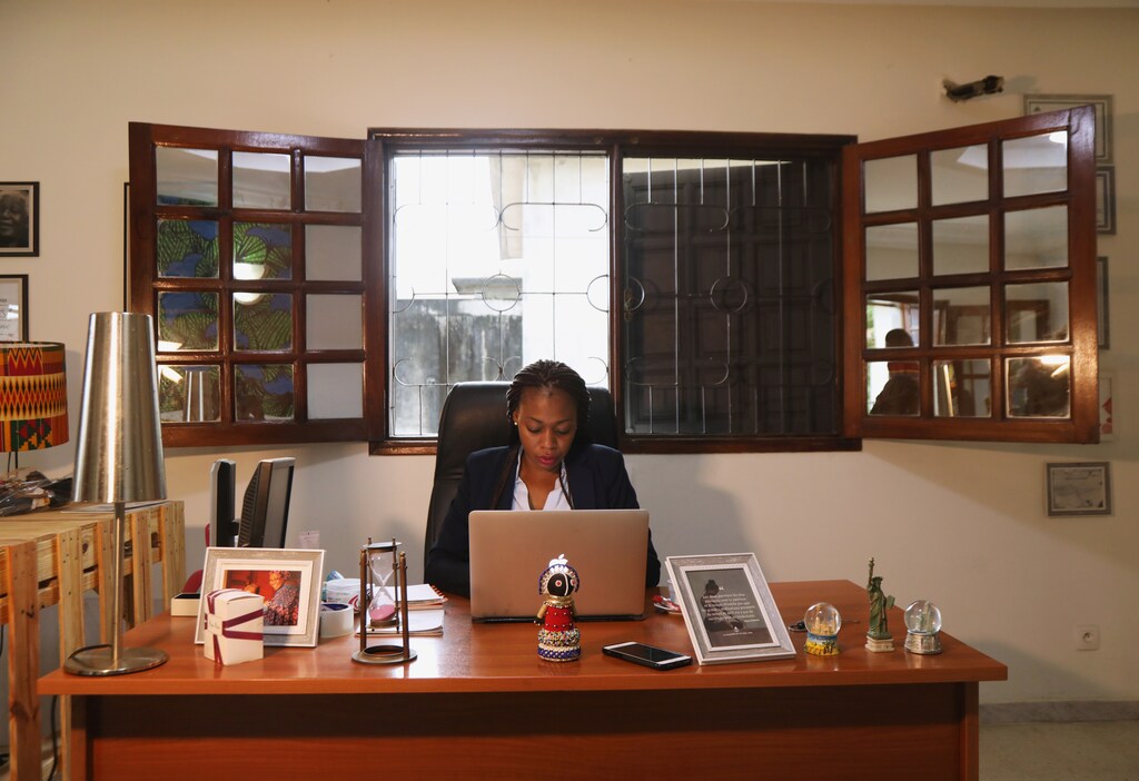 Sara Coulibaly, an Ivorian designer and creator of Naima Dolls brand of dark-skinned dolls, works at her office in Abidjan, Ivory Coast December 16, 2020. Picture taken December 16, 2020. REUTERS/Luc Gnago. - RC29SK9LNS3X