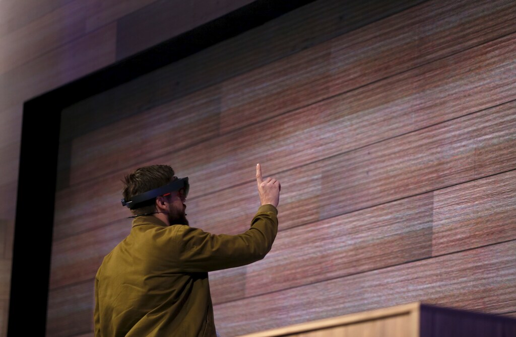 A man wears a device featuring Windows Holographic technology at Microsoft Build in San Francisco, California April 29, 2015. REUTERS/Robert Galbraith - GF10000077687