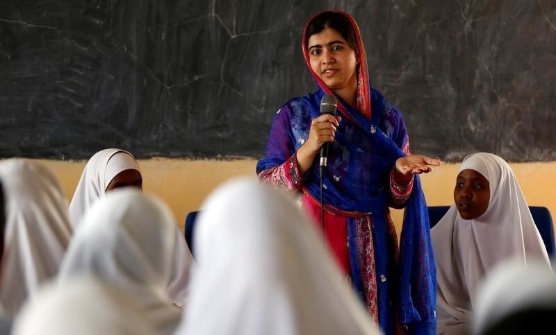 Pakistani Nobel Peace Prize laureate Malala Yousafzai addresses students at the Nasib Secondary School in Ifo2 area of Dadaab refugee camp during celebrations to mark her 19th birthday near the Kenya-Somalia border, July 12, 2016.