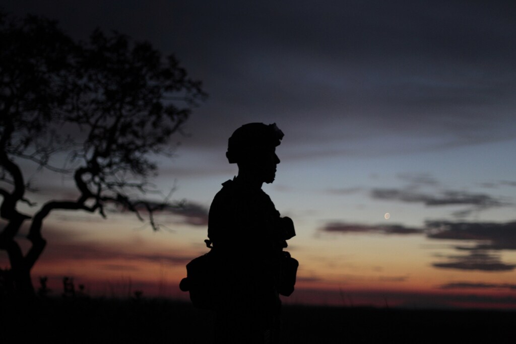 A Colombian anti-drugs policeman guards a cocaine laboratory in Guaracu town, Puerto Gaitan province, Meta, October 13, 2011.