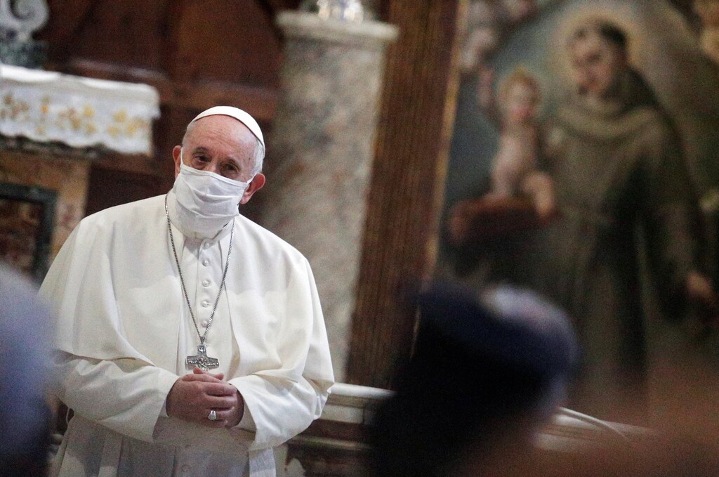 Pope Francis wearing a face mask attends an inter-religious prayer service for peace along with other religious representatives in the Basilica of Santa Maria in Aracoeli, a church on top of Rome's Capitoline Hill, in Rome, Italy, October 20, 2020. REUTERS/Guglielmo Mangiapane - RC2EMJ96W2KN