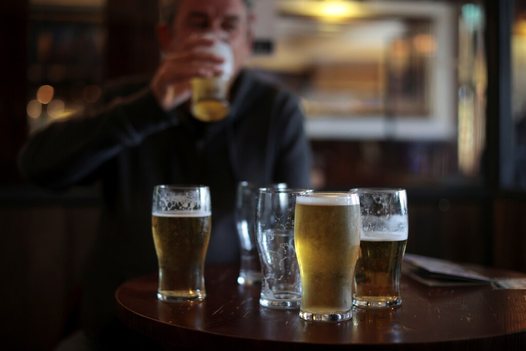 A man drinks beer at The Fox on the Hill pub as it reopens while coronavirus disease (COVID-19) restrictions continue to ease, in London, Britain, May 17, 2021. REUTERS/Hannah McKay
