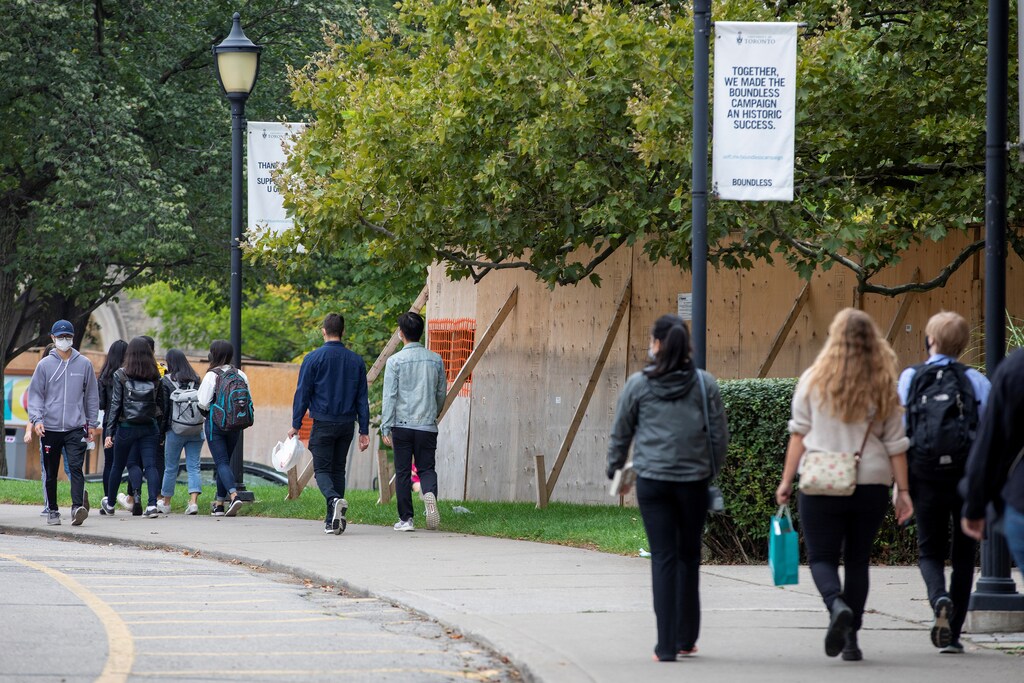 People walk on the grounds of the University of Toronto in Toronto, Ontario, Canada September 9, 2020. Picture taken September 9, 2020.