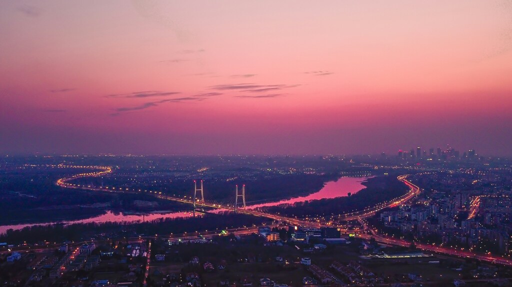 An aerial view of a city at night, illustrating the need for cities to adopt digital technology to be ready for change