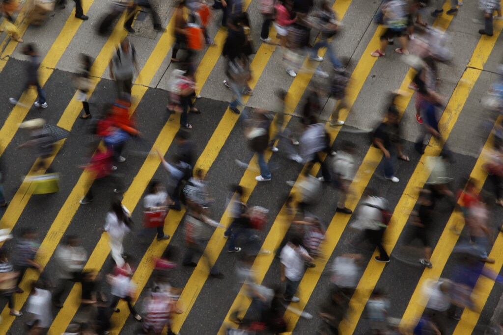ATTENTION EDITORS - IMAGE 1 OF 22 OF PICTURE PACKAGE '7 BILLION, 7 STORIES - OVERCROWDED IN HONG KONG. SEARCH 'MONG KOK' FOR ALL IMAGES - People cross a street in Mong Kok district in Hong Kong, October 4, 2011. Mong Kok has the highest population density in the world, with 130,000 in one square kilometre. The world's population will reach seven billion on 31 October 2011, according to projections by the United Nations, which says this global milestone presents both an opportunity and a challenge for the planet. While more people are living longer and healthier lives, says the U.N., gaps between rich and poor are widening and more people than ever are vulnerable to food insecurity and water shortages. Picture taken October 4, 2011. REUTERS/Bobby Yip (CHINA - Tags: SOCIETY) - LM2E7AE147B01