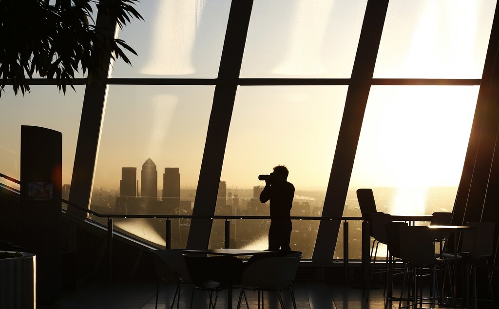 Canary Wharf is seen at sunrise from the Sky Garden of 20 Fenchurch Street, nicknamed the Walkie-Talkie building, in the financial district of the City of London, February 19, 2016.