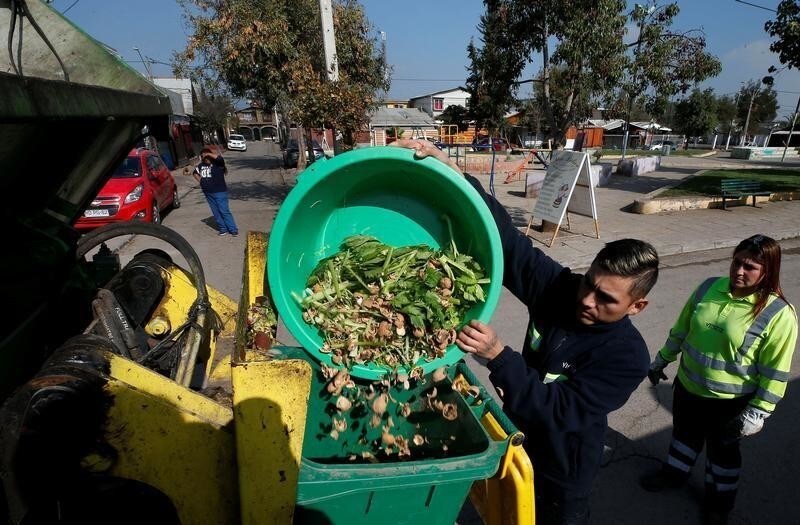 Municipal employees collect vegetable waste from homes in a neighbourhood to prepare compost, in Santiago, Chile May 9, 2019. Picture taken May 9, 2019. REUTERS/Rodrigo Garrido - RC146A1E8740