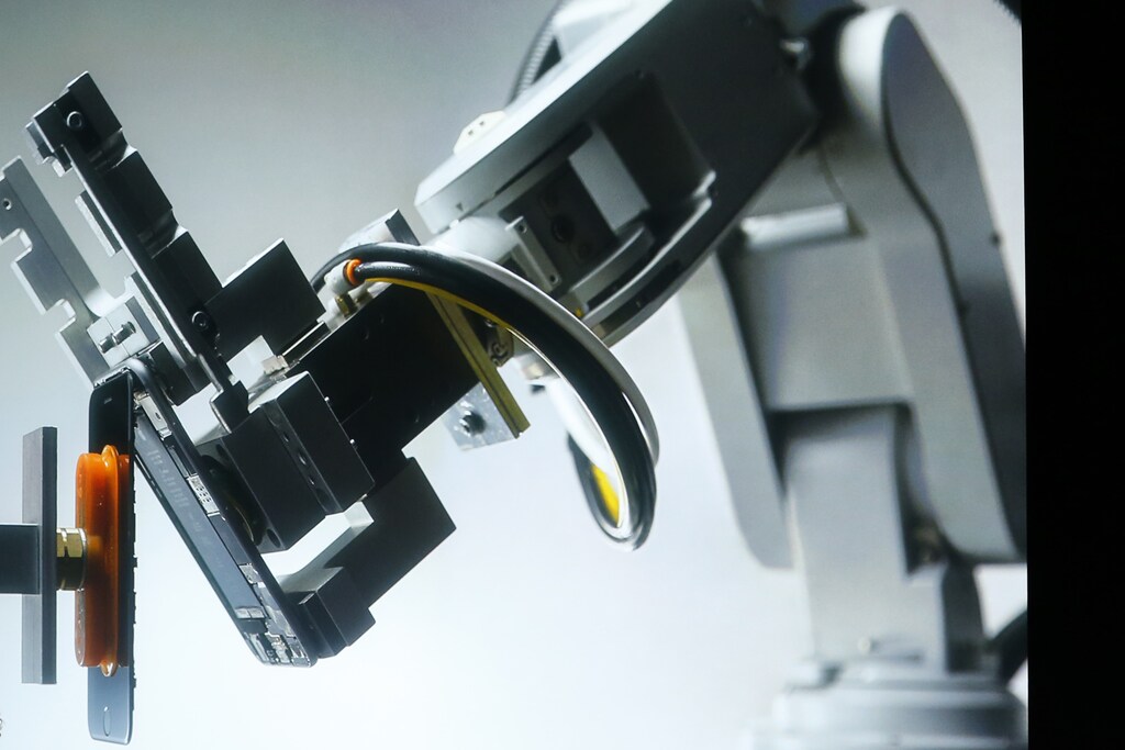 A robot named Liam that deconstructs iPhones is shown during an event at Apple headquarters in Cupertino, California March 21, 2016. REUTERS/Stephan Lam - TM3EC3L1AXA01