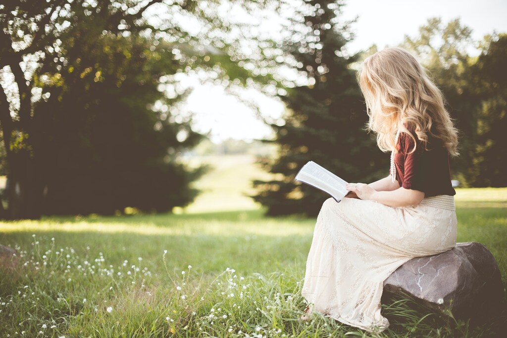 Kid reading a book.
