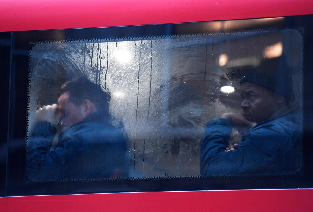 Commuters sit on a bus on Westminster Bridge during a strike on the Underground by members of two unions in protest at ticket office closures and reduced staffing levels, in London, Britain January 9, 2017. REUTERS/Toby Melville - LR1ED190RQ9JE