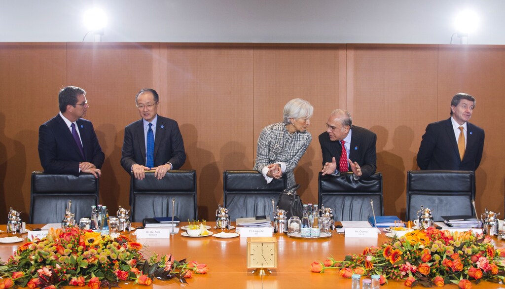 World Trade Organization (WTO) Director-General Roberto Azevedo (L-R) President of The World Bank Jim Yong Kim, Managing Director of the International Monetary Fund (IMF) Christine Lagarde, Angel Gurria, Secretary-General of the Organisation for Economic Cooperation and Development (OECD) and Guy Ryder, Director-General of the International Labour Organization (ILO) wait for the start of a meeting of leaders of economic and financial institutions with German Chancellor Angela Merkel, at the Chancellery in Berlin March 11, 2015. REUTERS/Stefanie Loos/Pool (GERMANY - Tags: POLITICS BUSINESS TPX IMAGES OF THE DAY) - LR2EB3B1BSXOH