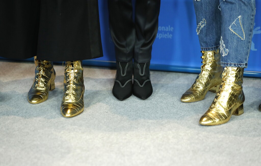 The shoes of director and screenwriter Joanna Hogg and actresses Tilda Swinton and Honor Swinton Byrne are pictured during a photocall to promote the movie "The Souvenir" at the 69th Berlinale International Film Festival in Berlin, Germany, February 12, 2019. REUTERS/Fabrizio Bensch - UP1EF2C165DL0