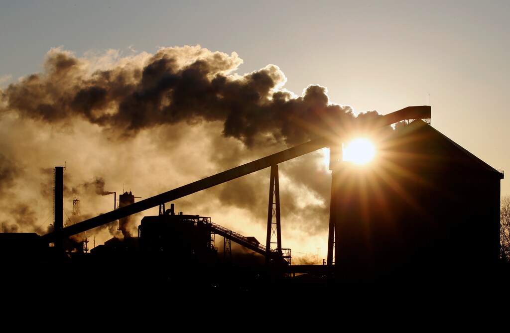The sun appears behind Tereos sugar factory in Escaudoeuvres, France, November 19, 2019. REUTERS/Pascal Rossignol
