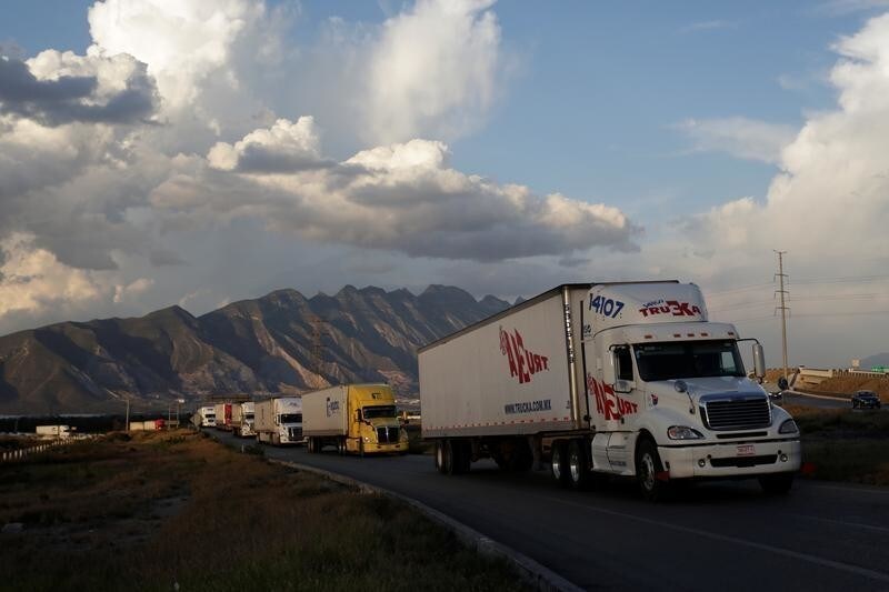 Cargo trucks are pictured at a highway on the outskirts of Monterrey, Mexico, July 6, 2017. Picture taken July 6, 2017. REUTERS/Daniel Becerril - RC151EF143F0