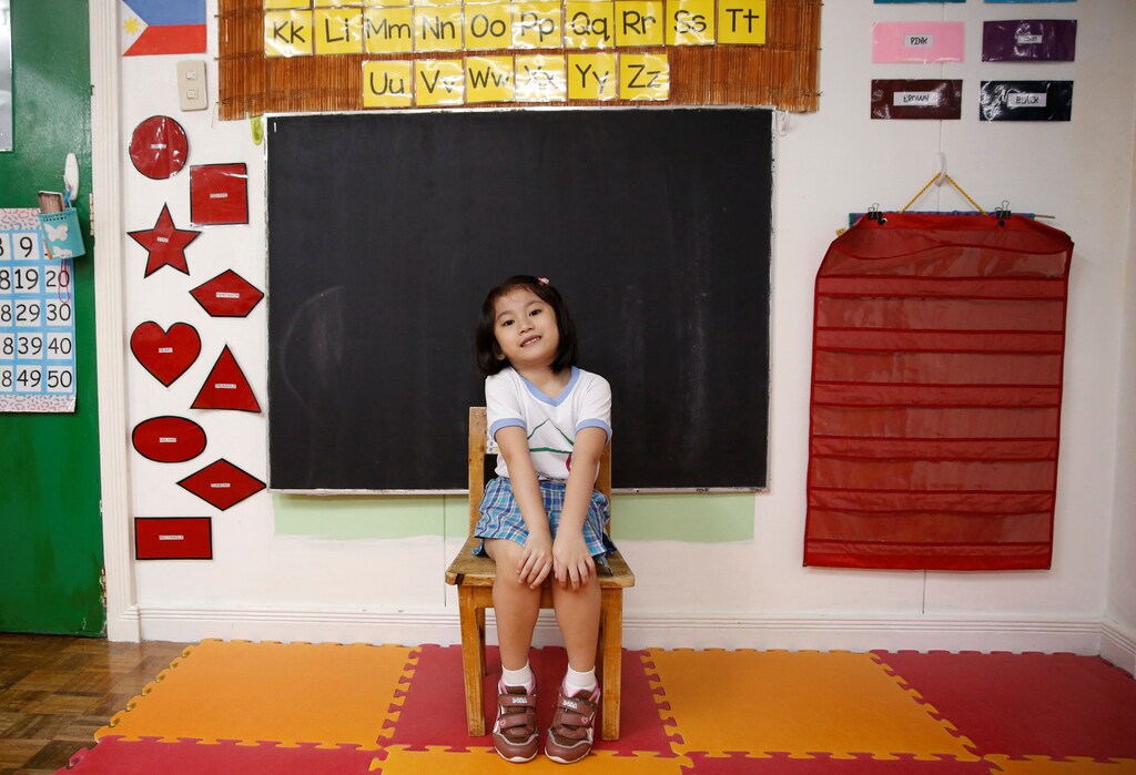Jaedene Alyzxandra Medina, 5, poses for a photograph inside her classroom at Child's Home Educational Center in Las Pinas, Metro Manila Philippines, November 29, 2016. REUTERS/Erik De Castro SEARCH "CHRISTMAS WISHES" FOR THIS STORY. SEARCH "WIDER IMAGE" FOR ALL STORIES. - RC162348C510