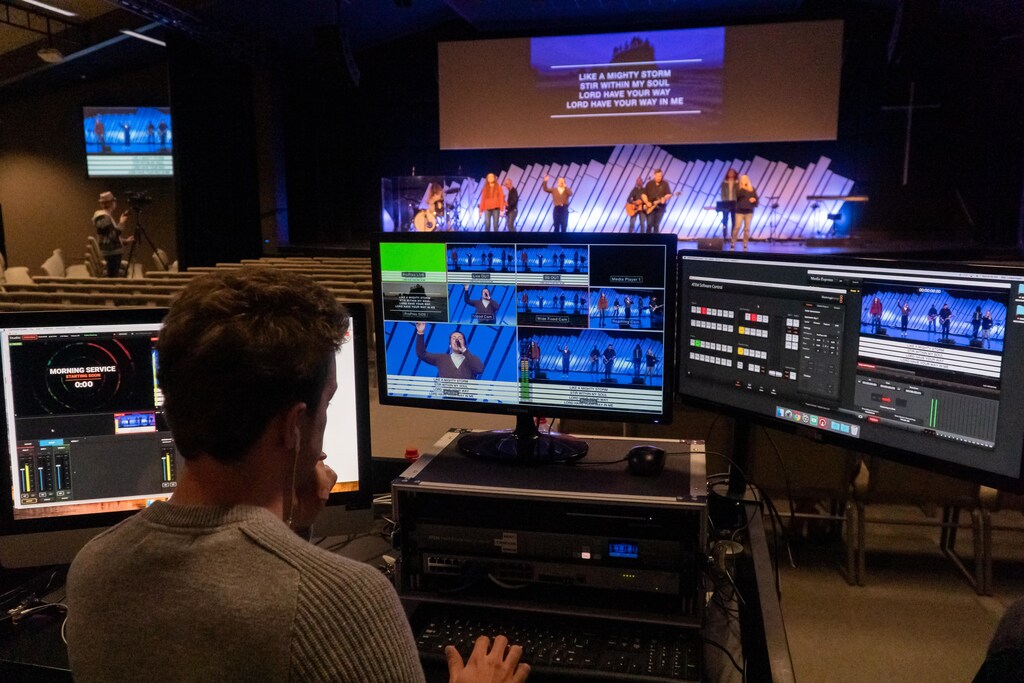 Media business: This image shows a man with a bank of control screens, illustrating the need to build digital trust