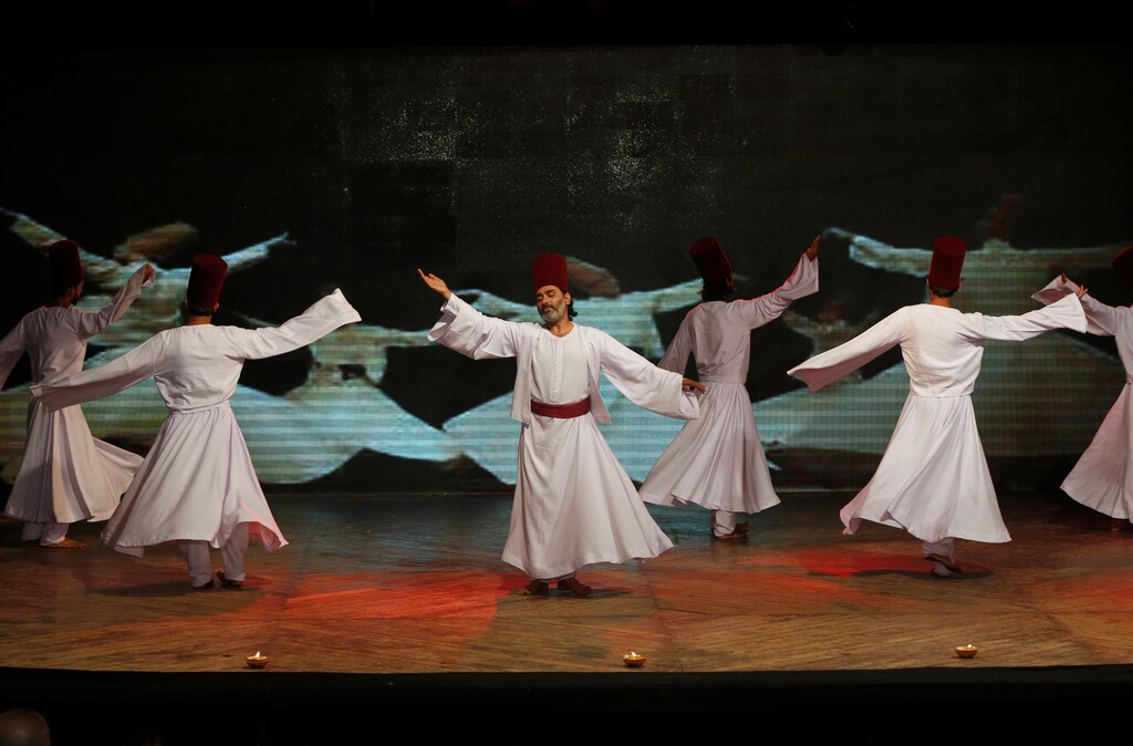 Pakistani dancer and choreographer Adnan Jahangir (C) and his troupe perform a Sufi dance during the dance festival in Karachi, Pakistan May 5, 2017. Picture taken May 5, 2017. REUTERS/Akhtar Soomro - RC1BB17BEB60