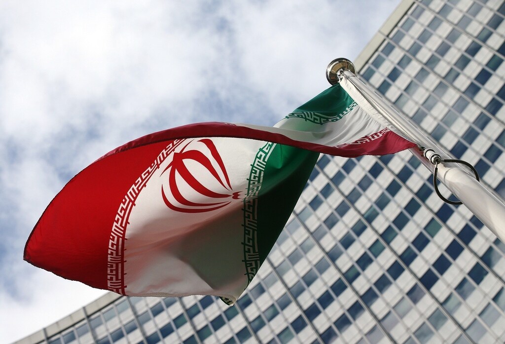 An Iranian flag flutters in front of the United Nations headquarters, during an International Atomic Energy Agency (IAEA) board of governors meeting, in Vienna, March 4, 2015. The U.N. nuclear watchdog chief said on Monday Iran was being slow to cooperate with his agency's investigation into the Iranian atomic programme and that the inquiry could not continue indefinitely. REUTERS/Heinz-Peter Bader (AUSTRIA - Tags: POLITICS ENERGY) - RTR4S0LT