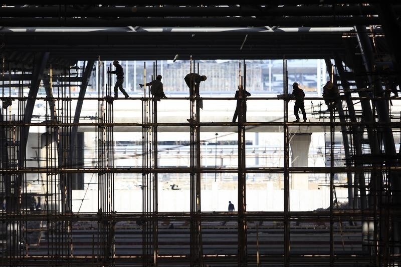 Migrant labourers work at a construction site near Hongqiao Airport in Shanghai March 11, 2010. Chinese property investment rose 31.1 percent in the first two months of this year, accelerating from a 16.1 percent rise in the whole of 2009, the National Bureau of Statistics said on Wednesday. REUTERS/Aly Song (CHINA - Tags: BUSINESS EMPLOYMENT SOCIETY) - RTR2BHXQ