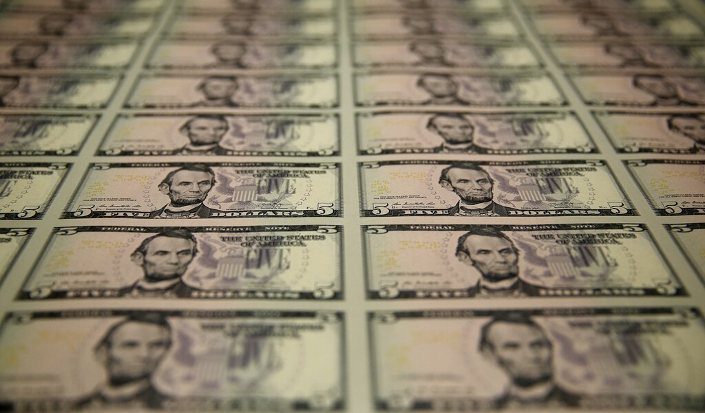 Sheets of former U.S. President Abraham Lincoln on the five-dollar bill currency are seen at the Bureau of Engraving and Printing in Washington March 26, 2015. The 150th anniversary of Lincoln's assassination at Ford's Theatre in Washington is April 15, 2015. REUTERS/Gary Cameron - WASEB3Q16Y301