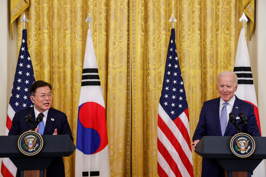 U.S. President Joe Biden reacts as South Korea's President Moon Jae-in speaks during a joint news conference after a day of meetings at the White House, in Washington, U.S. May 21, 2021. REUTERS/Jonathan Ernst - RC2NKN9QTJNQ