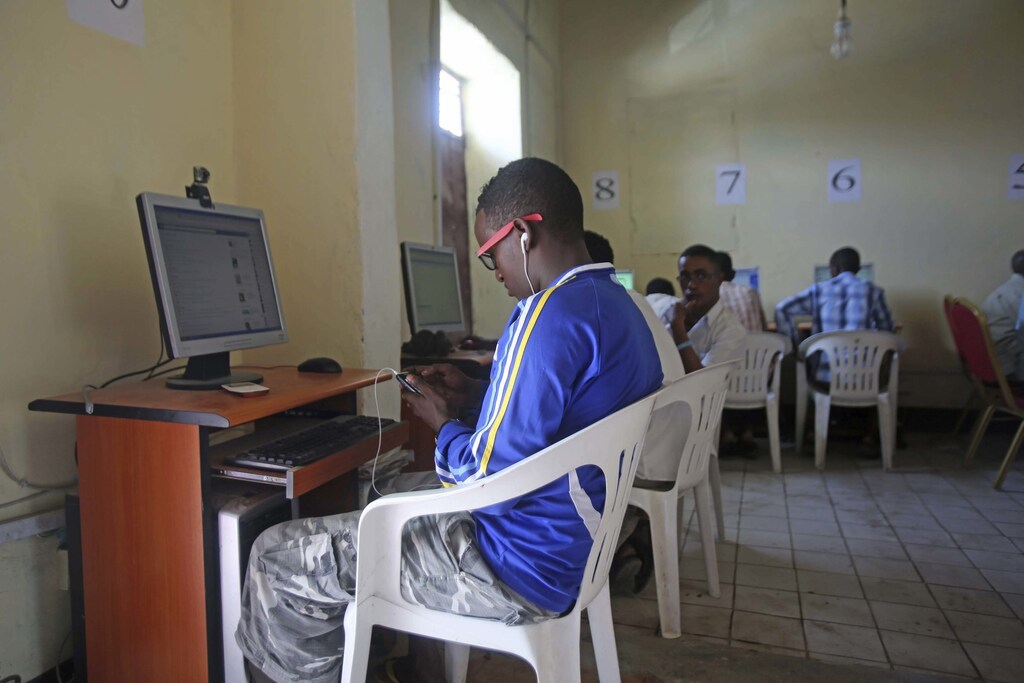 People use computers at an internet cafe in the Hodan area of Mogadishu October 9, 2013.