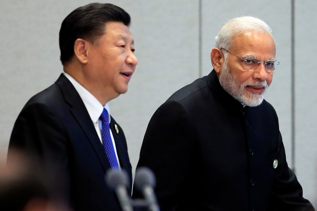 China's President Xi Jinping and India's Prime Minister Narendra Modi at the Shanghai Cooperation Organization summit in June 2018