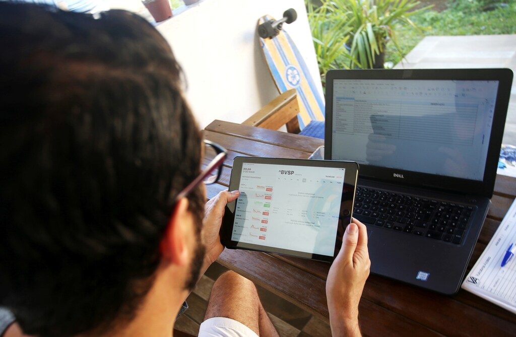 Diego Araujo Schulz, investor, works at his home during the spread of the coronavirus disease (COVID-19), in Sao Caetano do Sul, Sao Paulo state, Brazil, May 9, 2020. Picture taken May 9, 2020. REUTERS/Rahel Patrasso - RC2RRG9Q173G