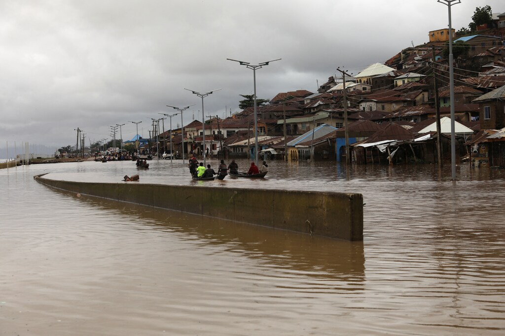 Floodwater breaks a river bank in Lokoja, Nigeria.