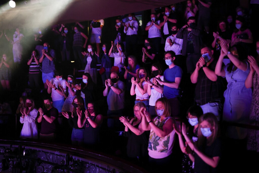 Guests applaud at the end of a performance of the West End show 'The Show Must Go On' at the Palace Theatre, amid the spread of coronavirus disease (COVID-19) in London, Britain, June 2, 2021. REUTERS/Henry Nicholls - RC2LSN9R713Q