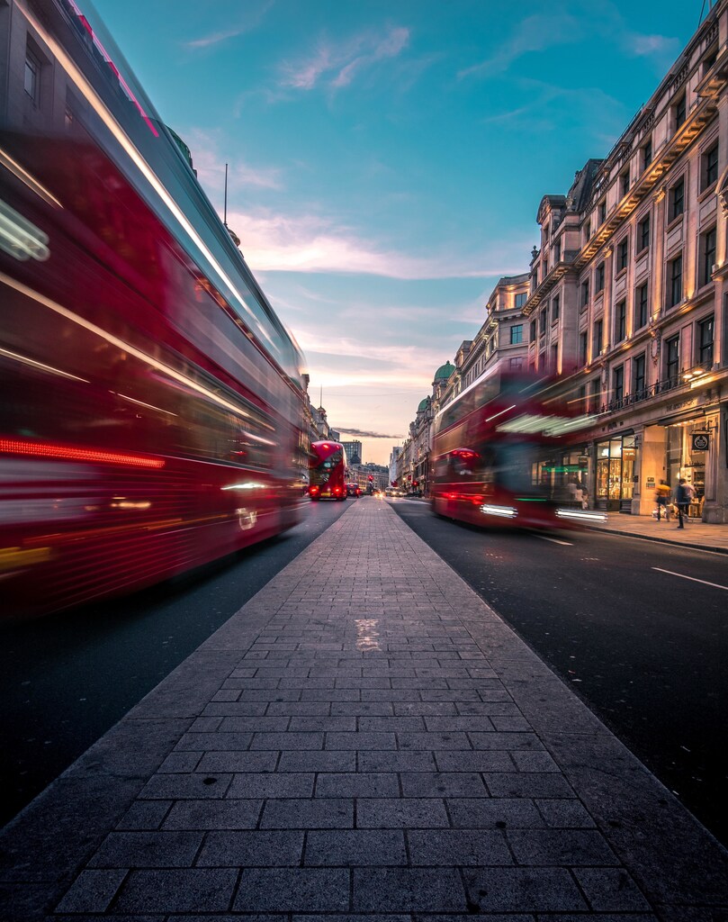 Buses travelling along Oxford St in London, United Kingdom.