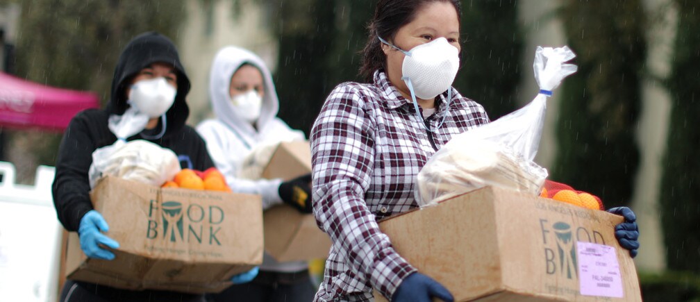 People pick up fresh food at a Los Angeles Regional Food Bank giveaway.