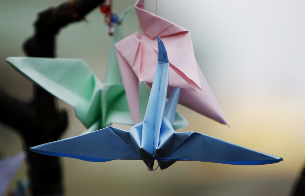 Origami birds hang from a tree in memory of victims of the magnitude 9.0 earthquake and tsunami which struck Japan last week, in the centre of Sofia, March 17, 2011. REUTERS/Oleg Popov (BULGARIA - Tags: DISASTER SOCIETY ENVIRONMENT) - RTR2K053