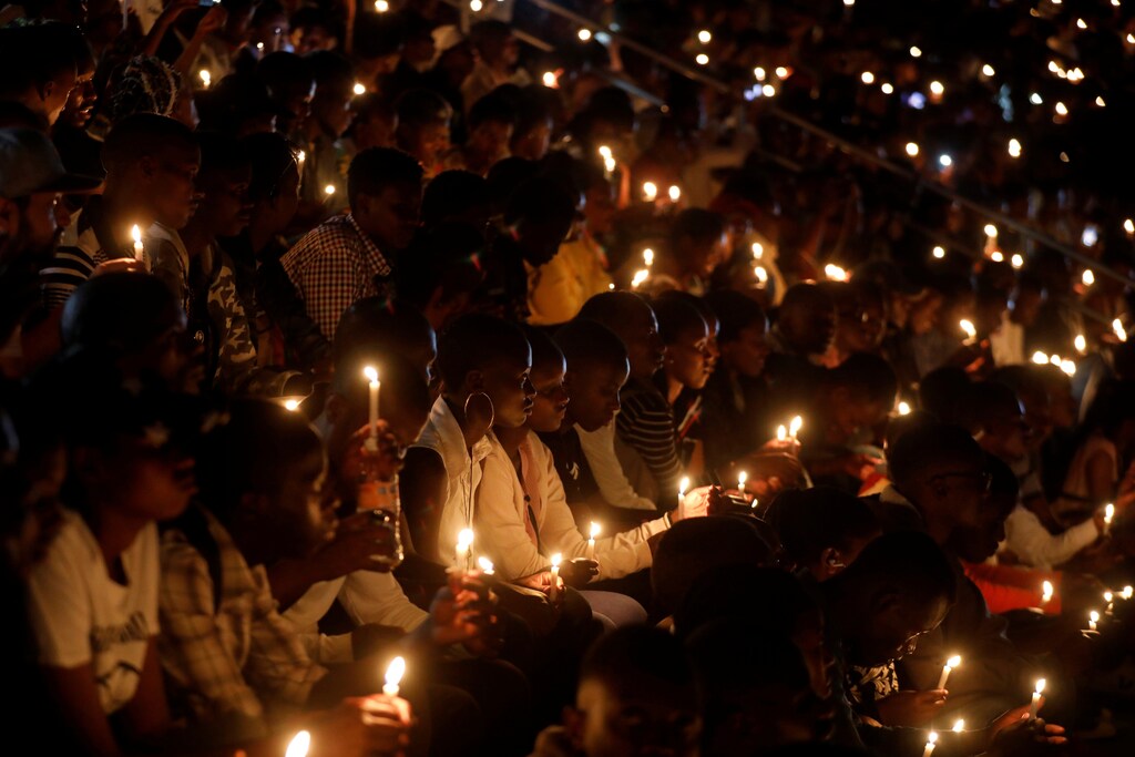 grenocide trauma mental health - Participants hold candles while holding a night vigil during a commemoration ceremony marking the 25th anniversary of the Rwandan genocide, at the Amahoro stadium in Kigali, Rwanda April 7, 2019. REUTERS/Baz Ratner - RC16AEFF9C60