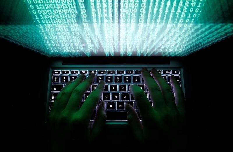 A man types on a computer keyboard in this illustration picture February 28, 2013. REUTERS/Kacper Pempel/Illustration/File Photo - RTX2J32R