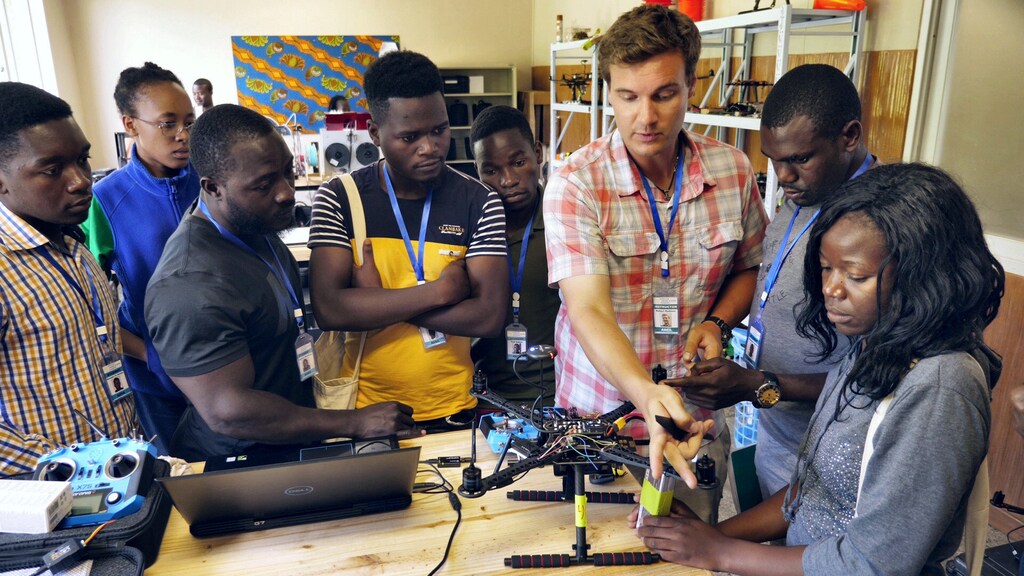 An instructor teaches students how to assemble a drone at the newly opened African Drone and Data Academy in Lilongwe, Malawi, January 24, 2020. Picture taken January 24, 2020. REUTERS/Eldson Chagara - RC28QE9290TR