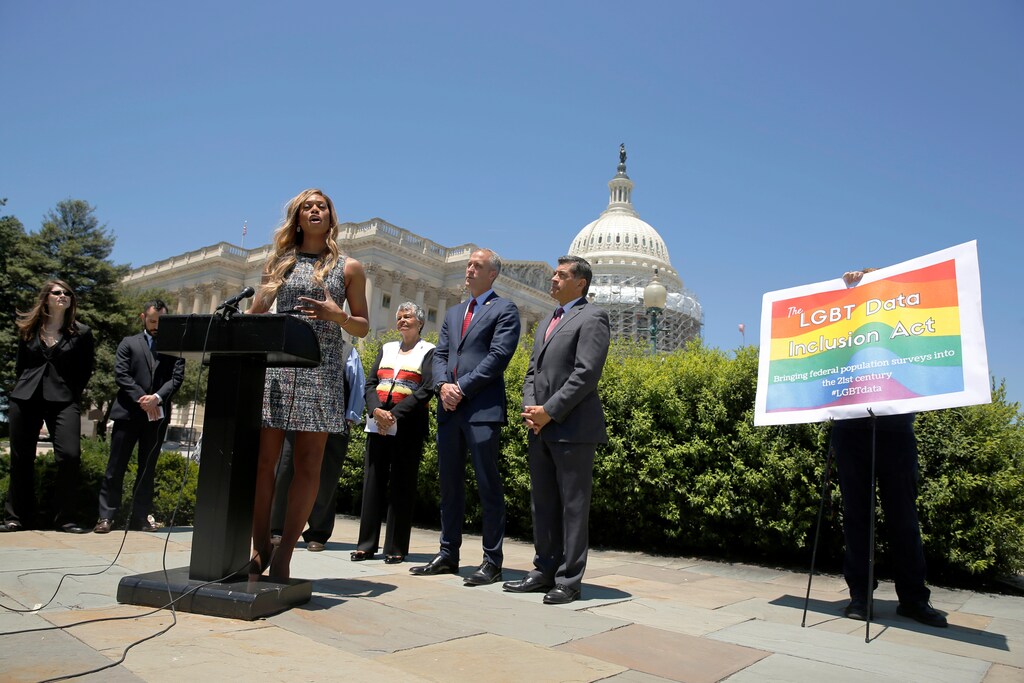 Actress Laverne Cox (at lectern) speaks at a news conference with Democratic lawmakers in favor of the LGBT Date Inclusion Act at the U.S. Capitol in Washington, U.S. June 9, 2016. REUTERS/Jonathan Ernst - RTSGTPK