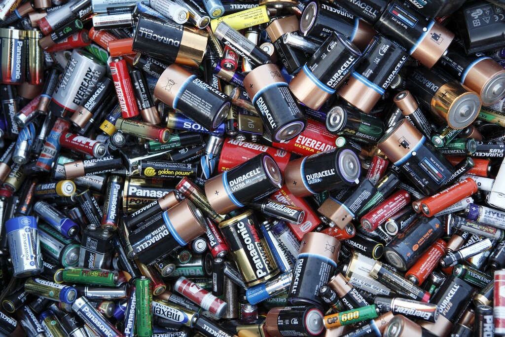 Batteries sit in a collection box at a recycling centre in London December 8, 2009. REUTERS/Kevin Coombs (BRITAIN) - LF1E5C90Z9H01