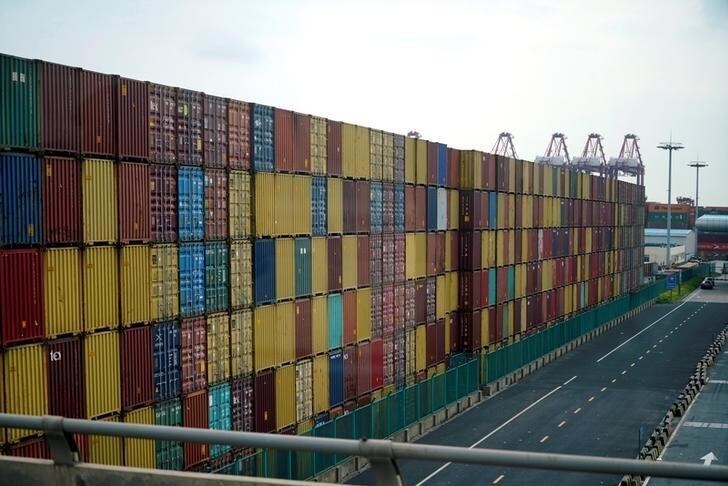 Containers are seen at the Yangshan Deep Water Port, part of the Shanghai Free Trade Zone, in Shanghai, China March 14, 2018. REUTERS/Aly Song