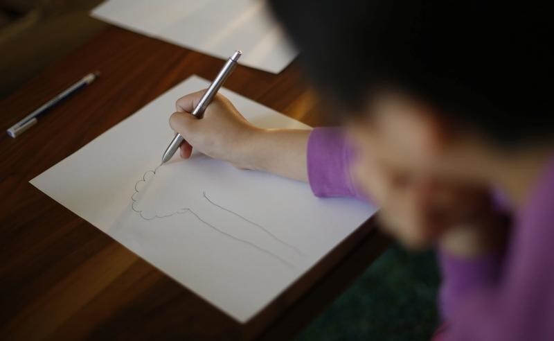 A nine-year-old girl who spent more than three months in a temporary shelter in Tokyo after being reported as a victim of abuse, is pictured at her psychotherapist's office in Tokyo, Japan March 17, 2017.
